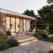 Terrasse contemporaine reliant une maison lumineuse à un jardin végétalisé, avec des matériaux naturels, du mobilier épuré et un éclairage doux.